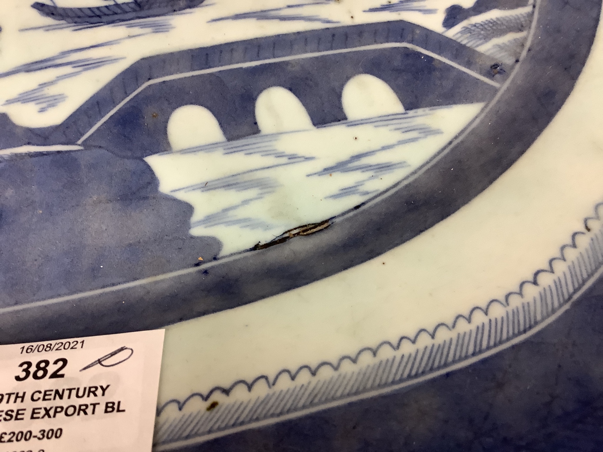 A 19th century Chinese export blue and white plate, decorated with pagoda scenes, length 42cm